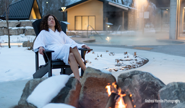 woman by fire outdoor spa