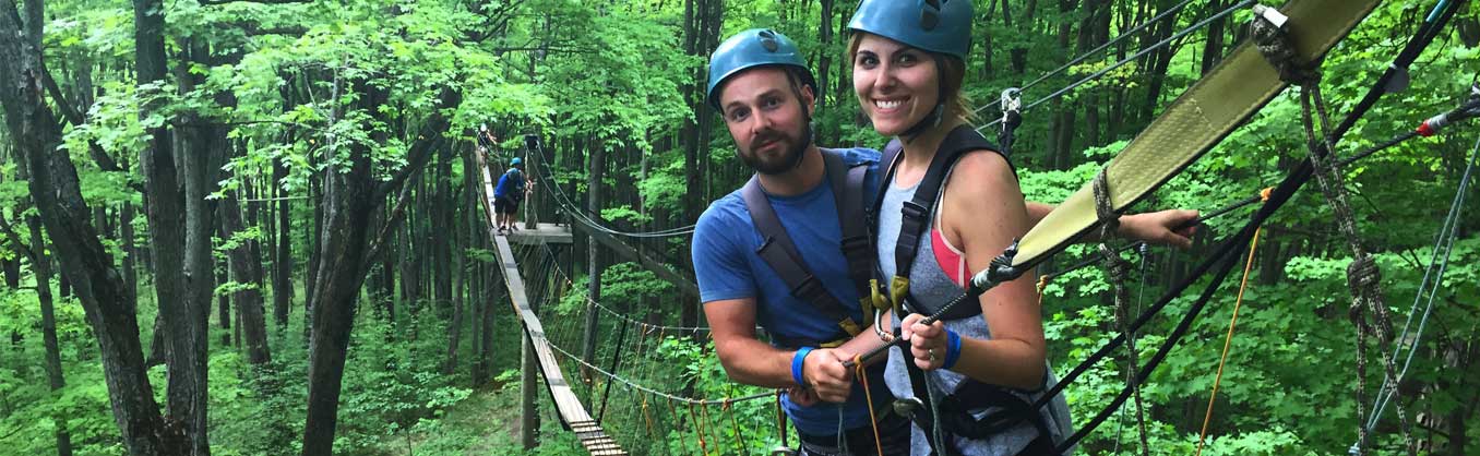 A Couple on the suspension bridge during a canopy tour