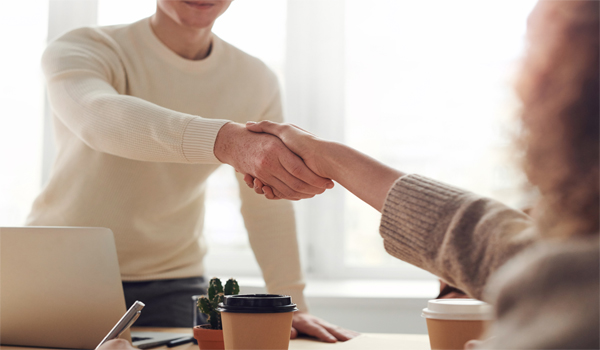 two people shaking hands