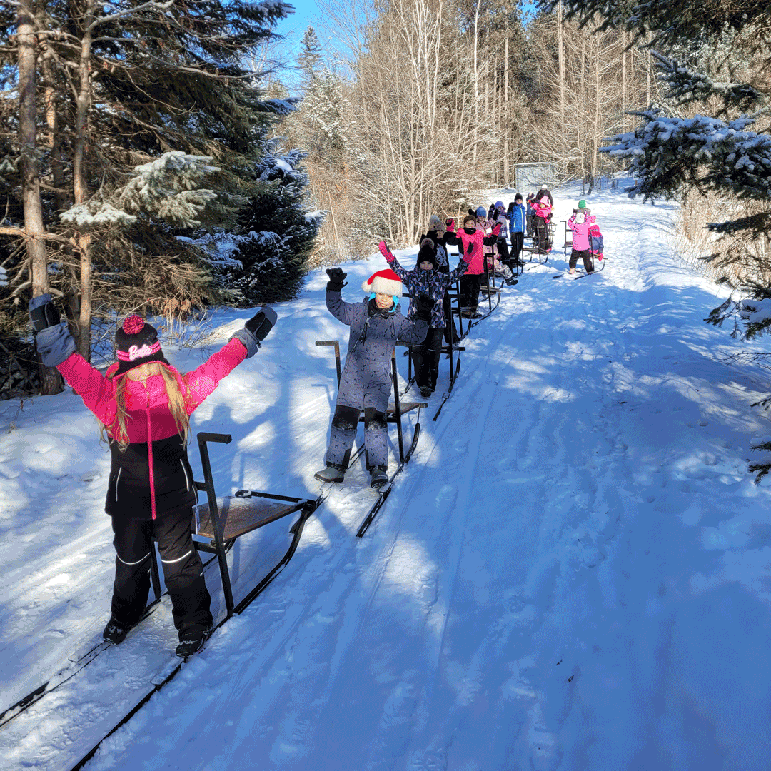 Kids in snow kick sledding
