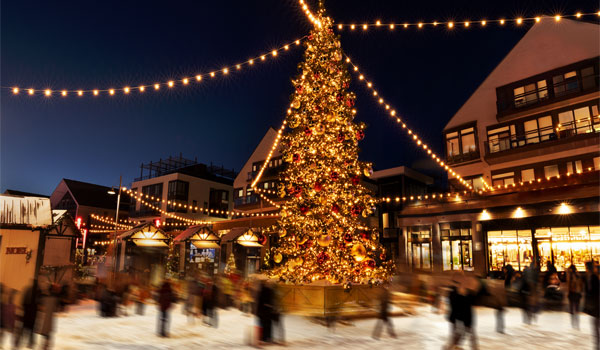 Tall Christmas tree with lights and ornaments
