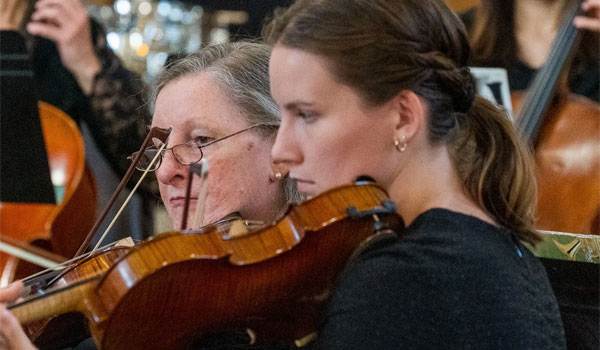 Huronia Symphony members playing violins