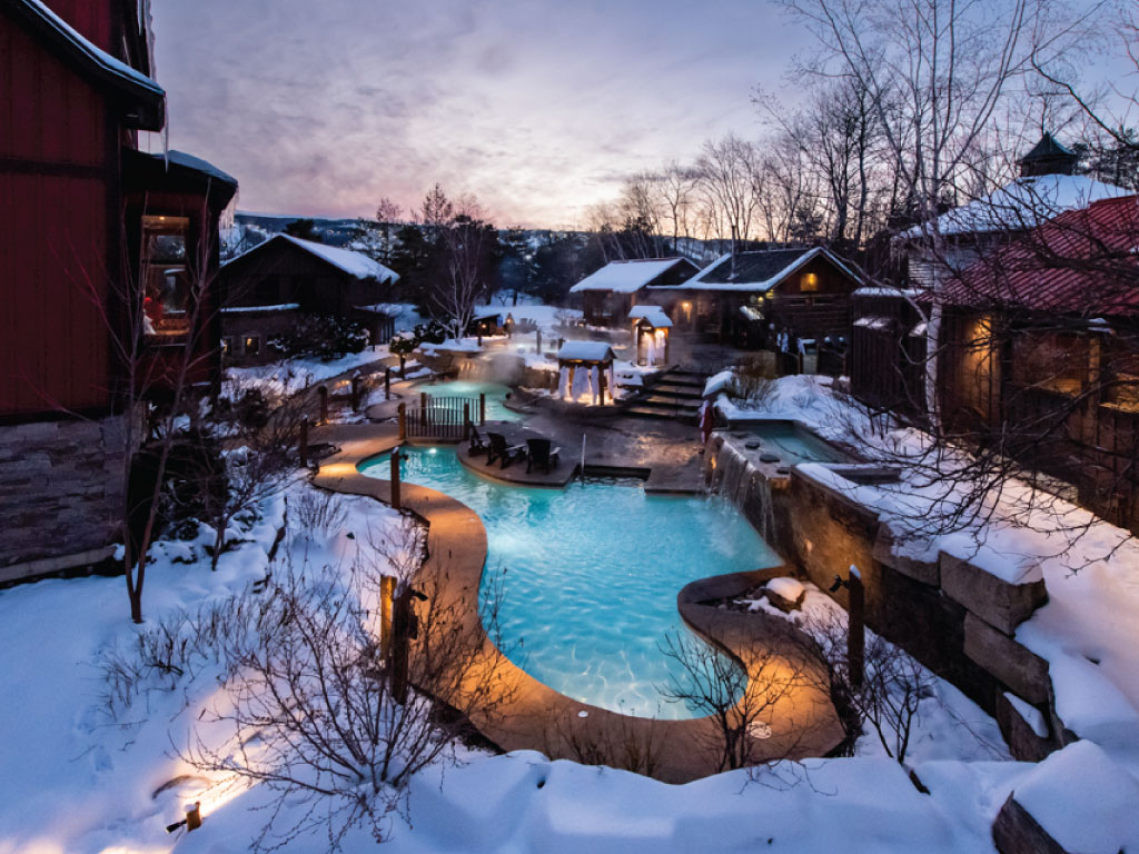 Beautiful view of Scandinave Spa pools in winter
