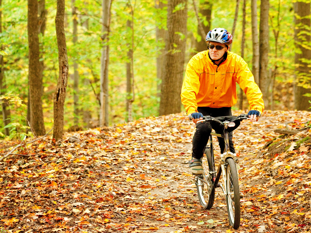 Man biking through a trail
