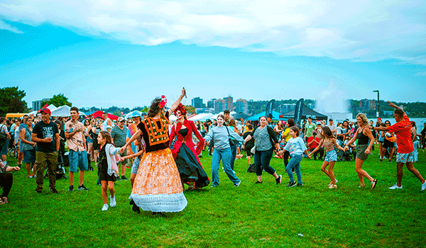 People dancing on Barrie's waterfront during Carnival Barrie