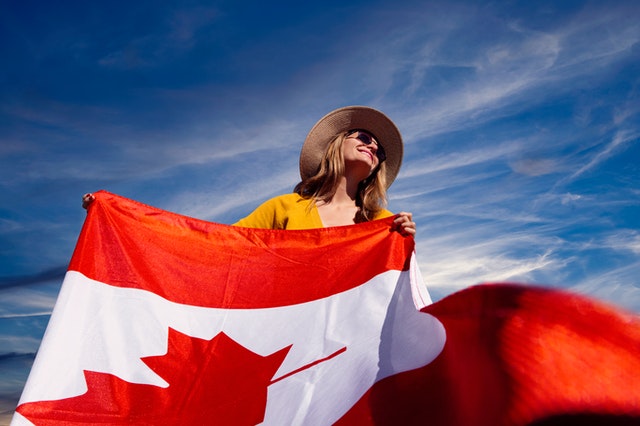 a-photograph-of-a-woman-holding-a-canadian-flag-2961063 woman with canadian flag