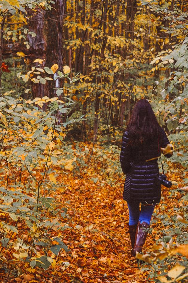 woman walking in fall leaves