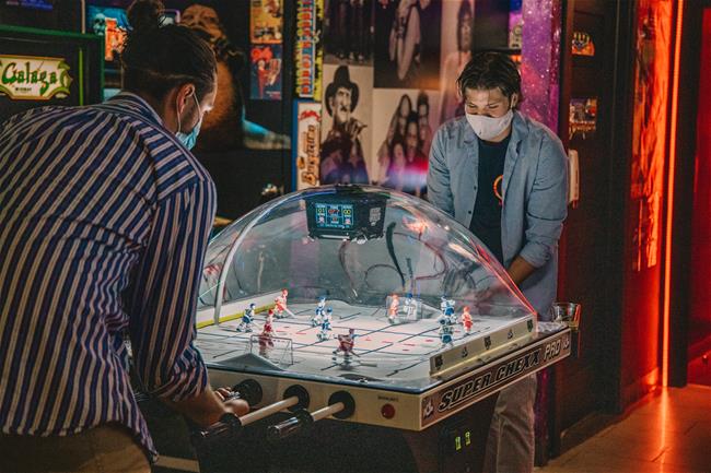 LAF_0357 2 guys playing air hockey