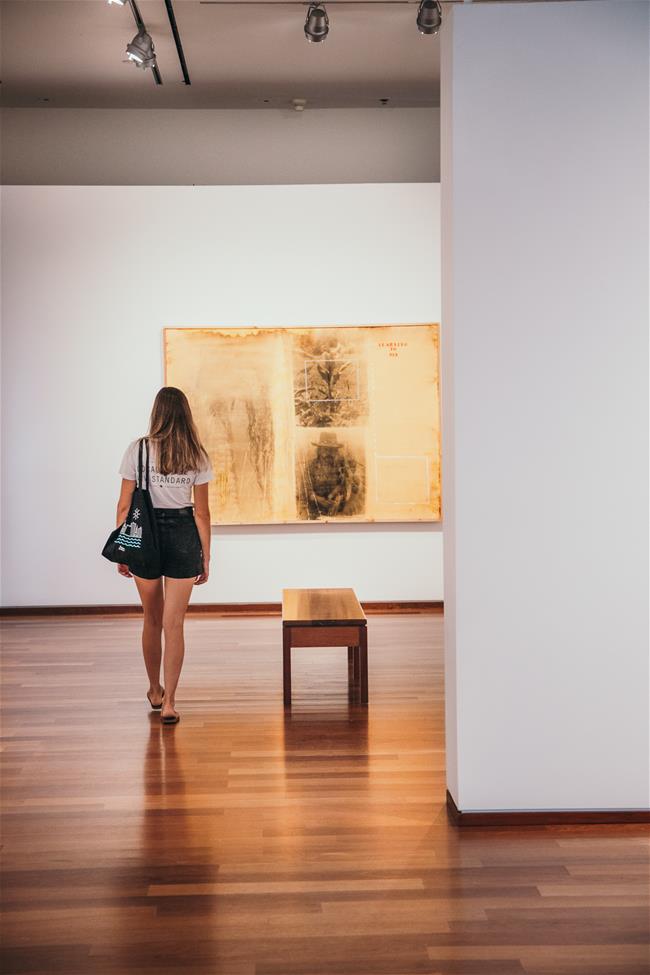 LAF_6887 woman from behind walking through art gallery