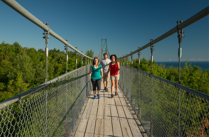 summer-bridge--1---700x460 3 people on suspension bridge