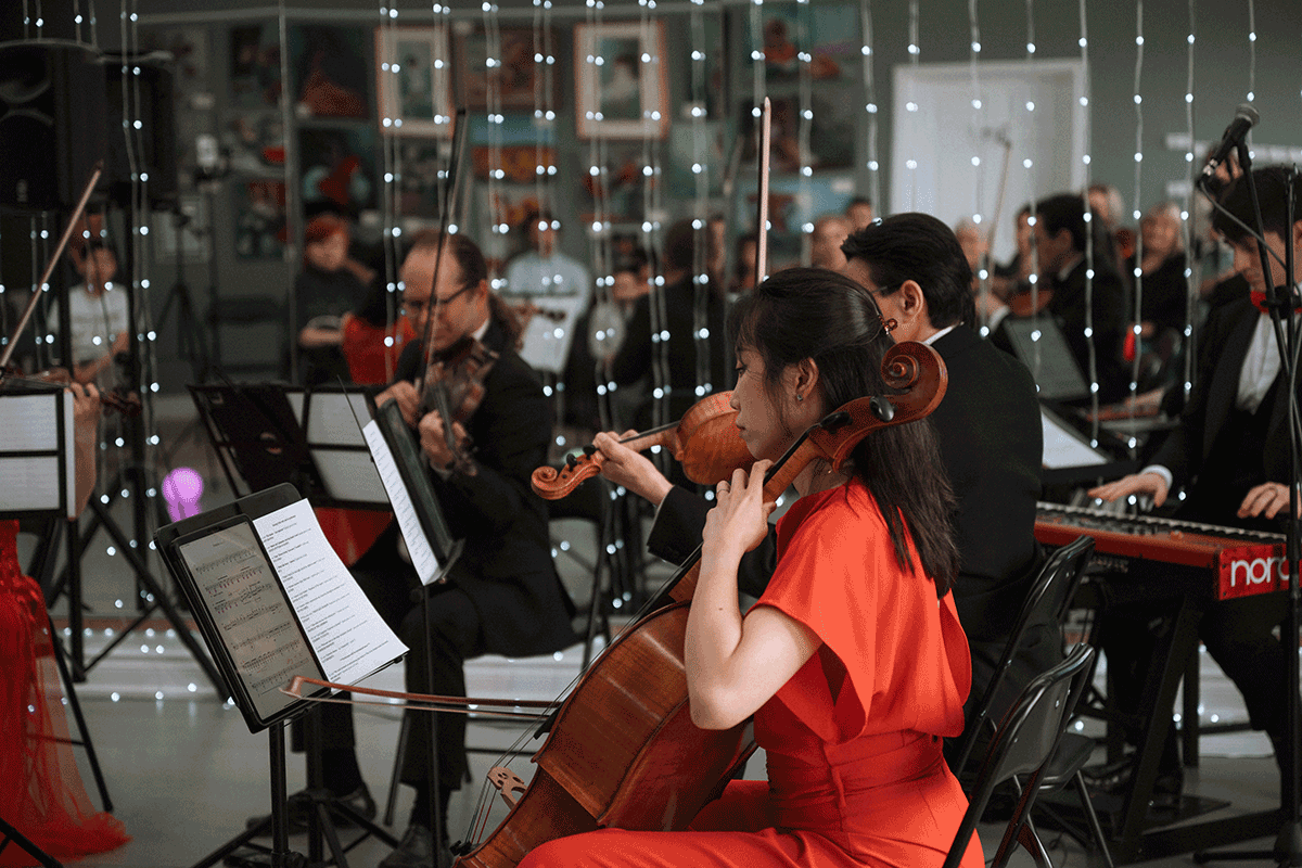 Violinists performing for an audience at The Arts House