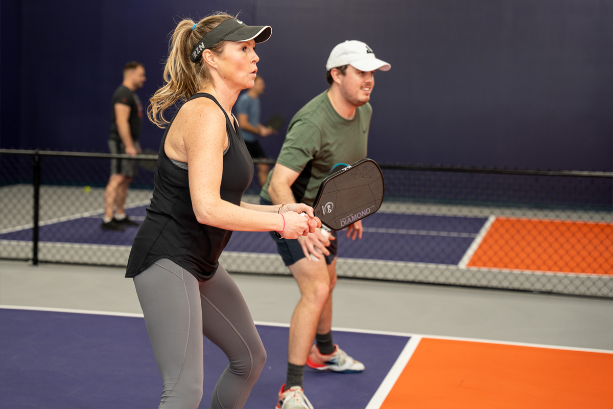 Pickleplex - Women and Man playing pickleball