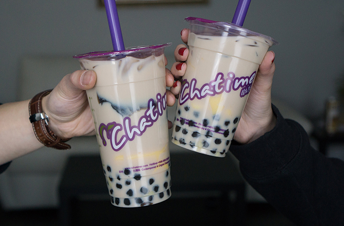 Two people with Chatime drinks