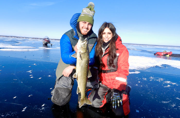 A couple ice fishing with Fish Crazy Guide Services