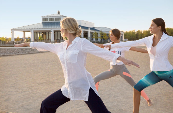 Woman doing yoga at Friday Harbour beach