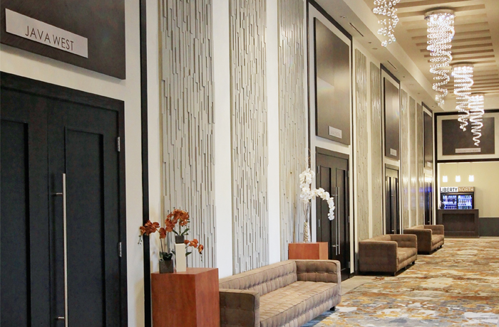 Liberty North event centre front entry and lobby featuring dazzling  chandeliers and comfortable sofas