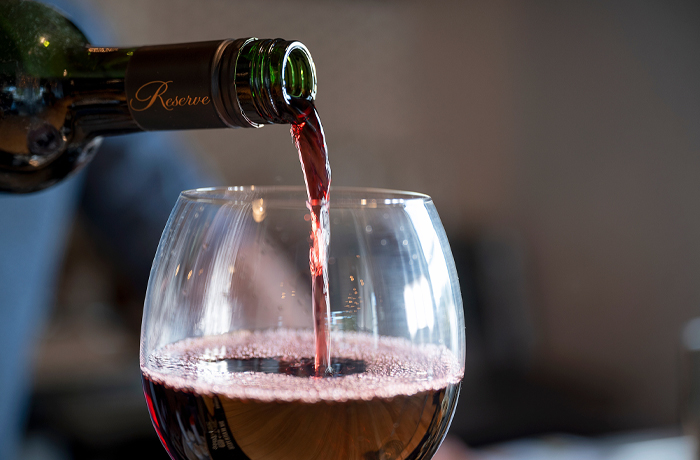 Wine being poured into a glass