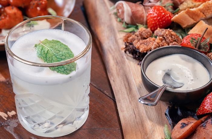 cocktail and food on table