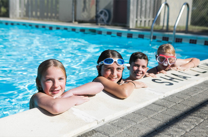 kids playing in pool at KOA campground