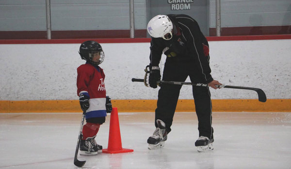 NTR programs picture of coach and skater